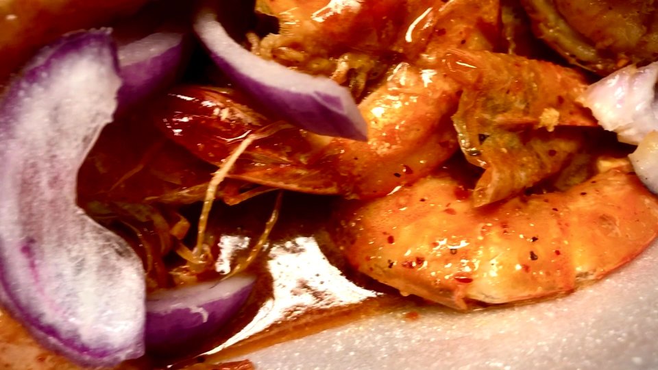 Seafood dishes on a restaurant table.