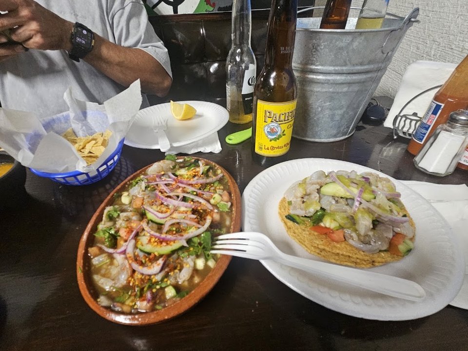 Plated seafood with rice and lime.